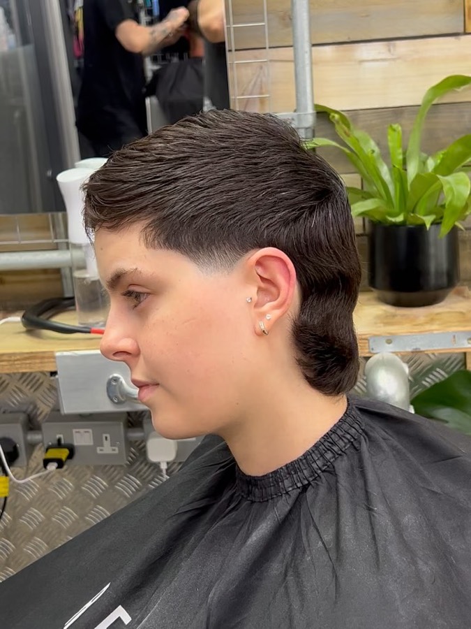 A blunt fringe with tapered sides.