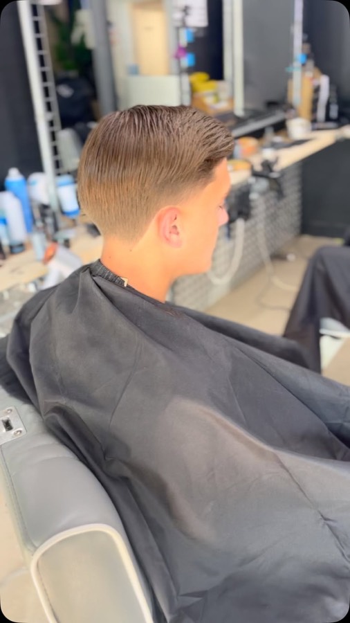 A child's scissor cut, side profile.