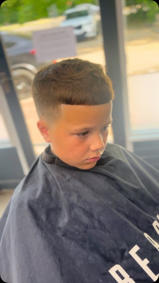 A child's side part, freshly cut.