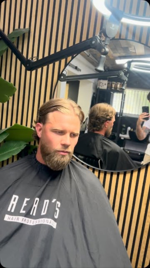 A blonde crop and full beard finished in the Read's cape.