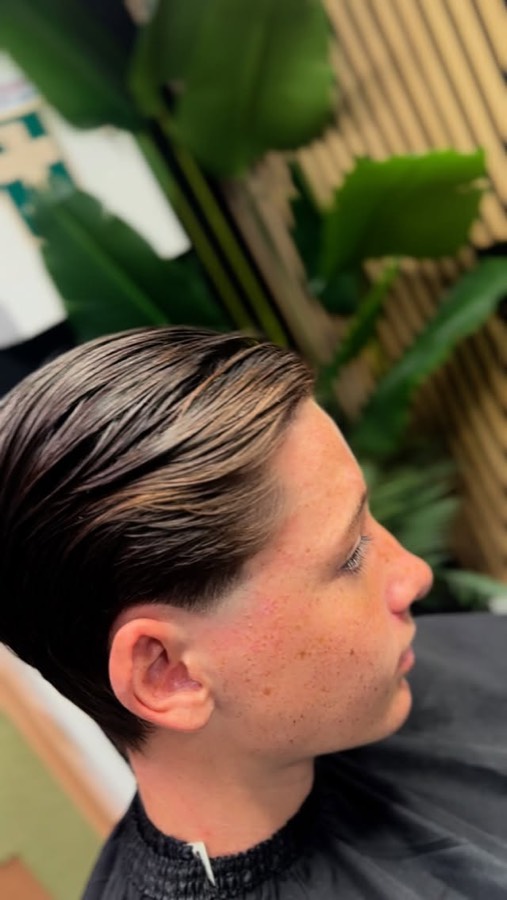 A long top swept to one side over a faded back.