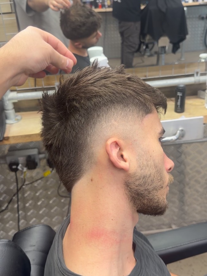 The back of a textured crop with a clean taper.